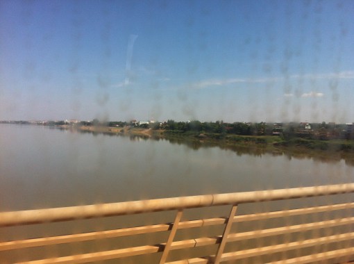 a view from the Friendship bridge through a dirty bus window