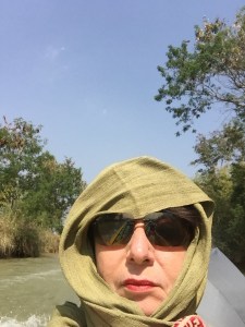 protecting myself from the sun reverberation on my way to  Indein